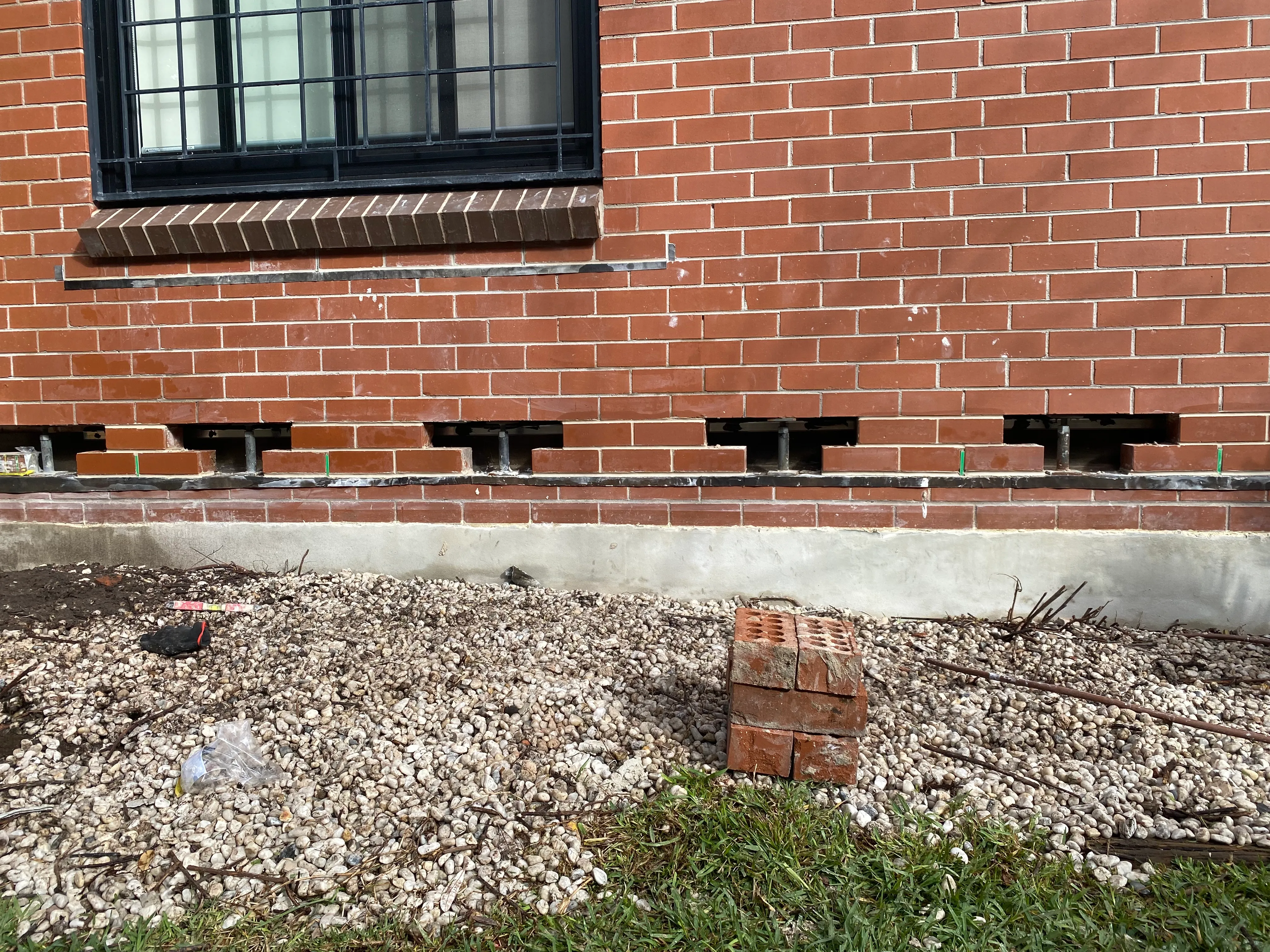 Cavity flashing remediation work on a Sydney brick wall