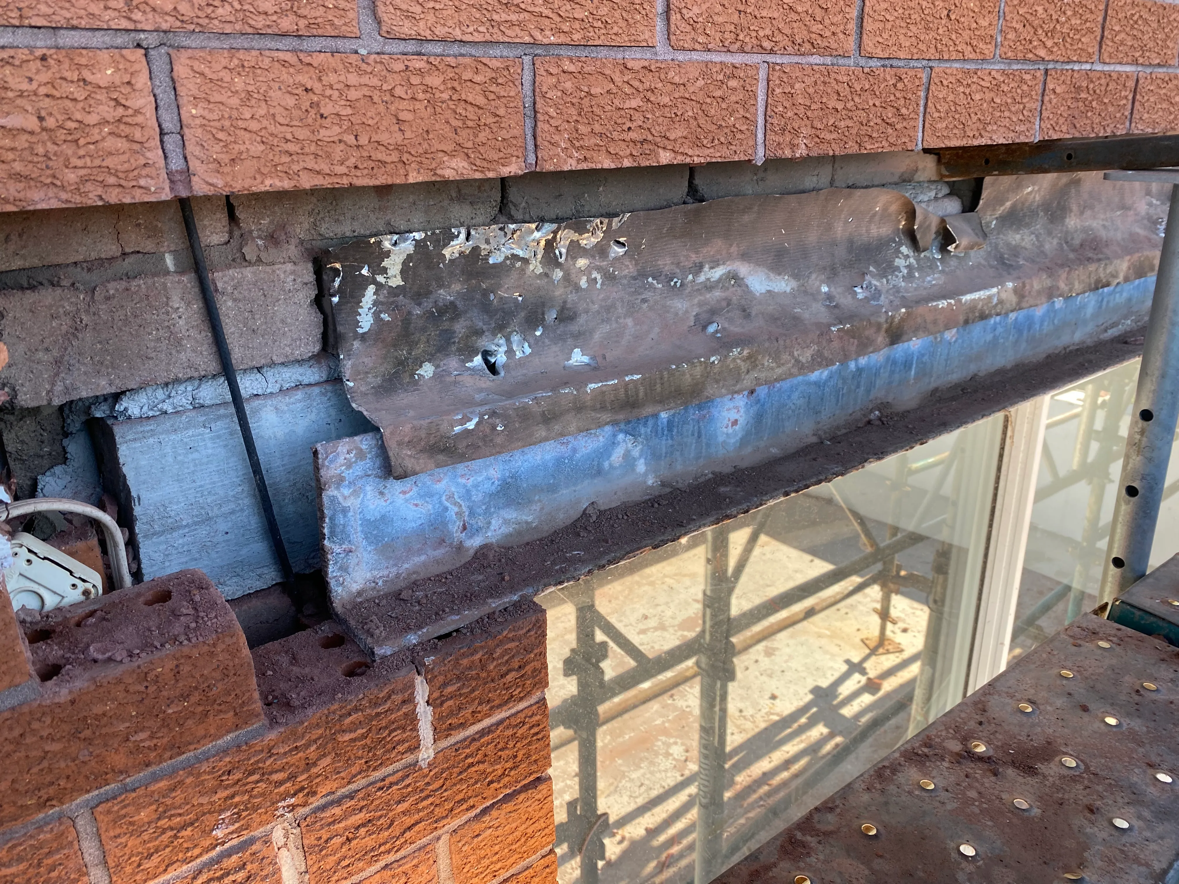 Cavity flashing remediation work on a Sydney brick wall