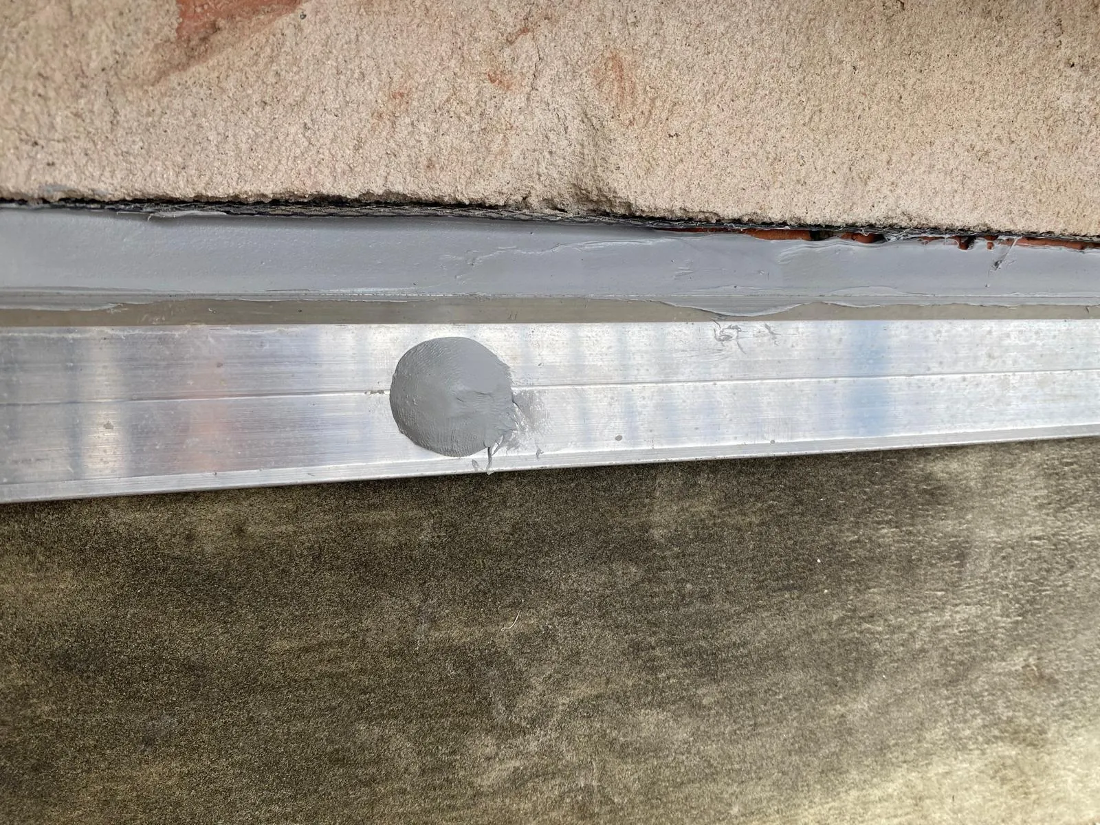 Cavity flashing remediation work on a Sydney brick wall