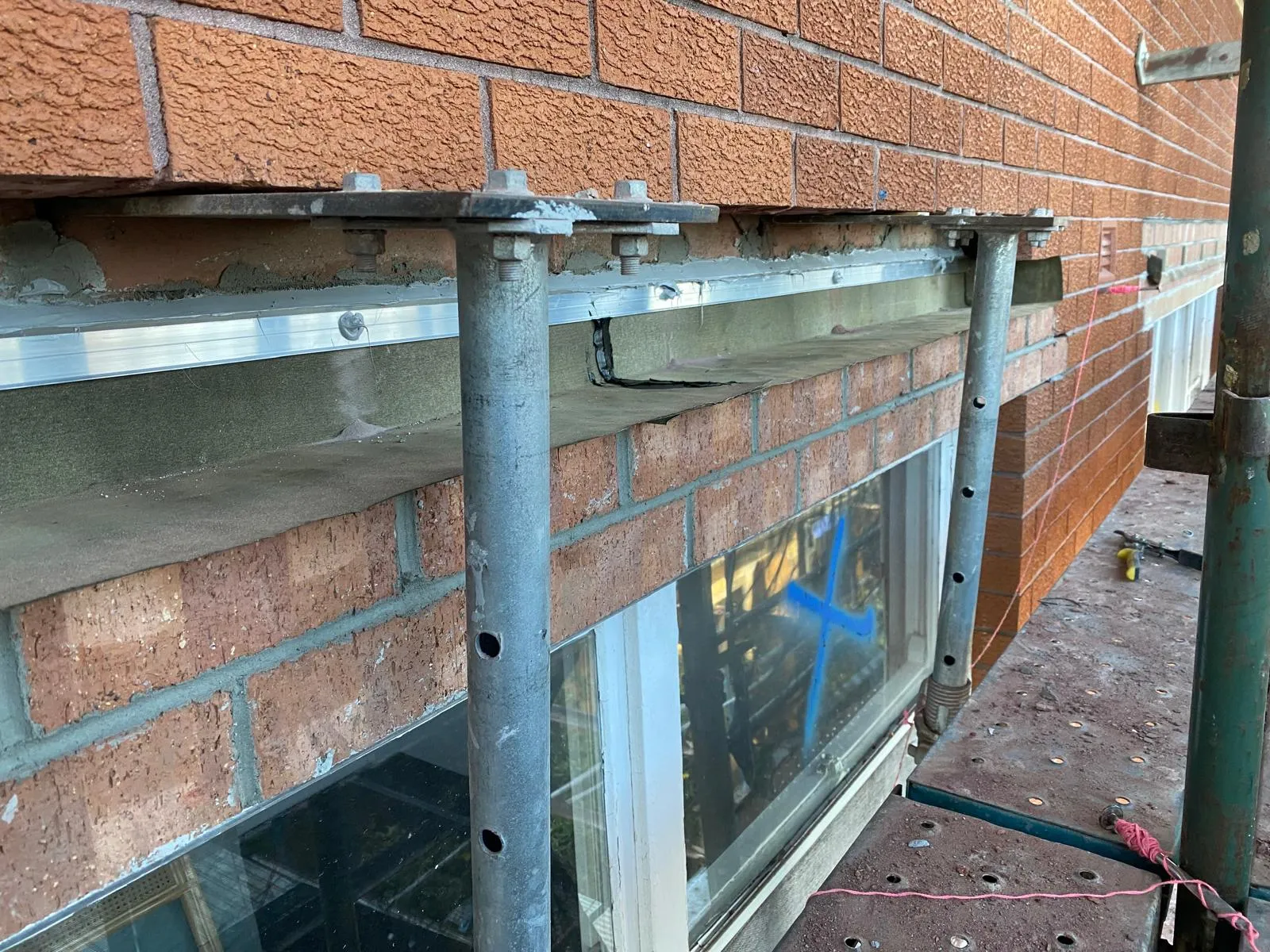 Cavity flashing remediation work on a Sydney brick wall
