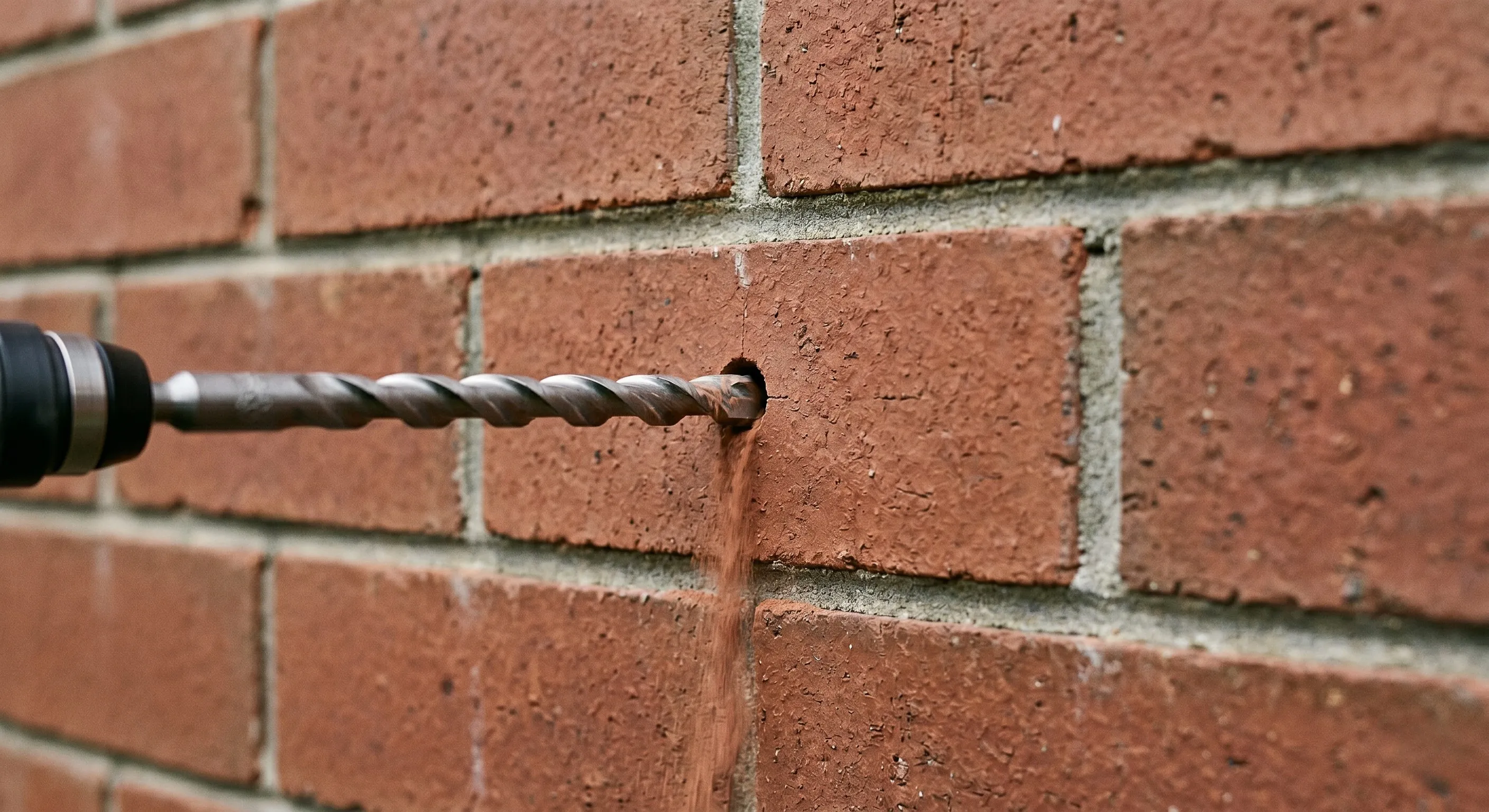 Remedial wall tie replacement on a Sydney brick wall